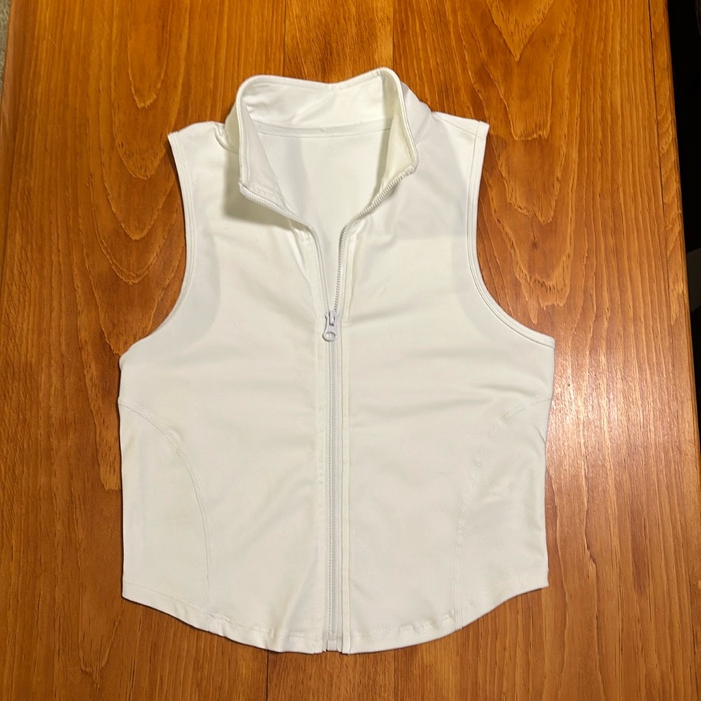 Zip front sleeveless golf/tennis top